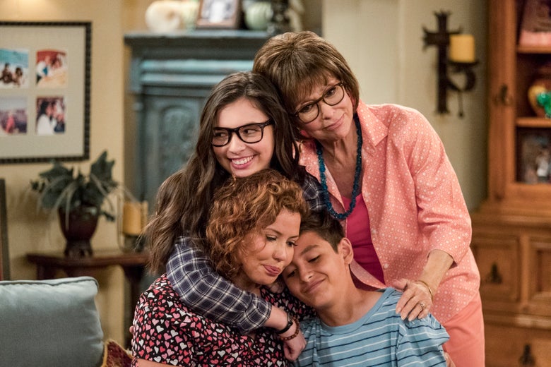 The cast of One Day at a Time embraces.